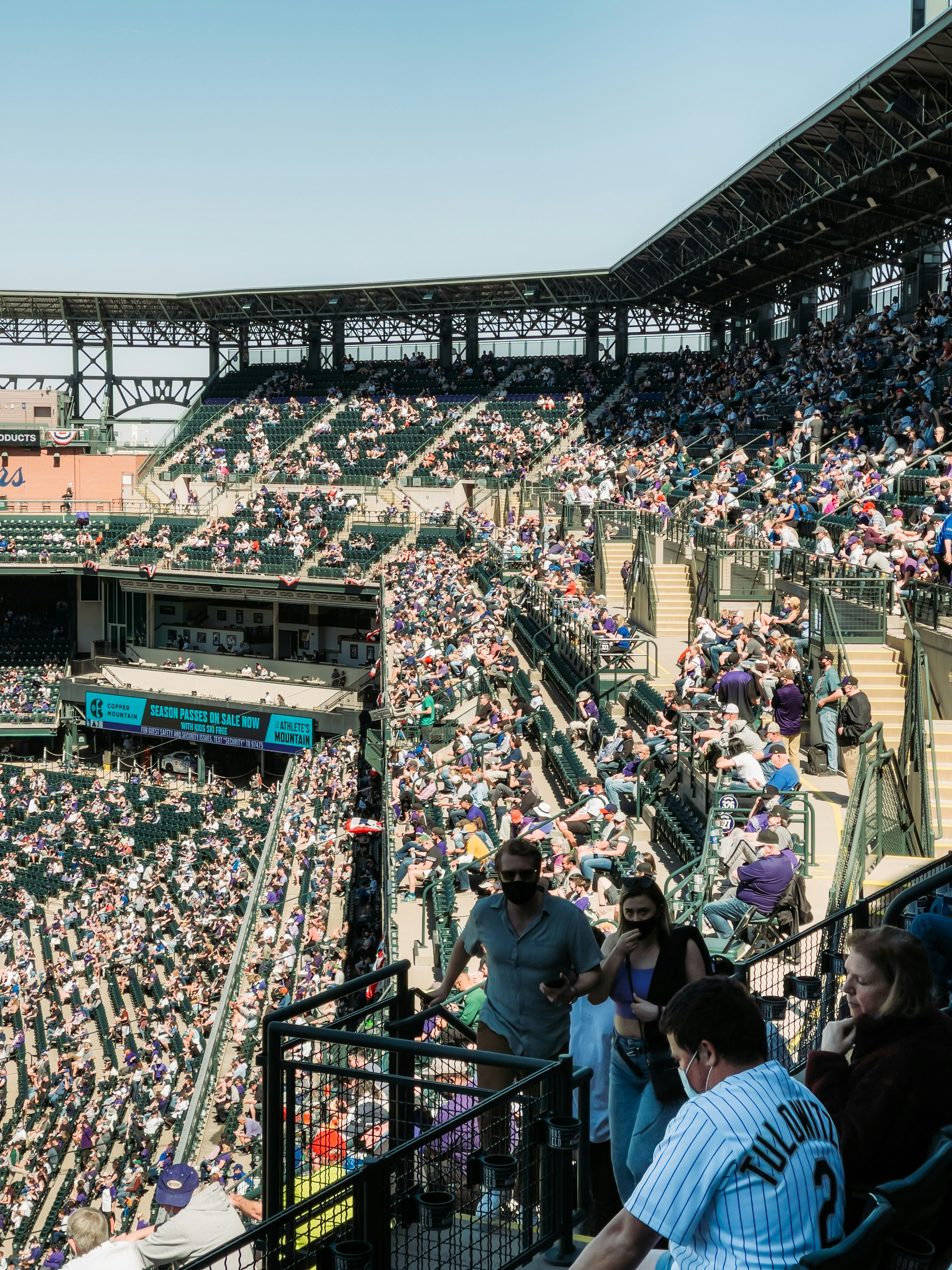 people on a stadium during daytime